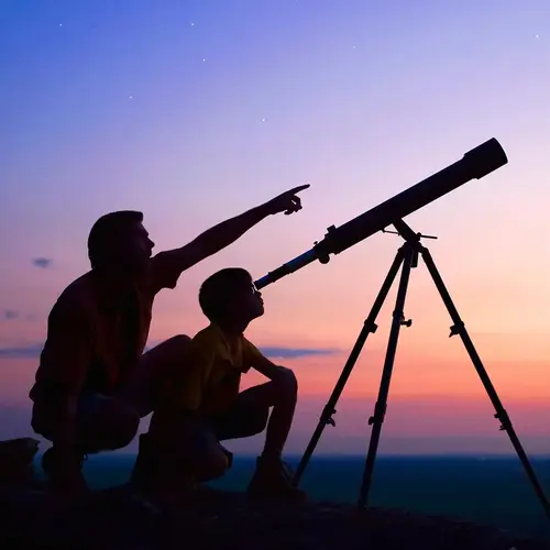 Adult and child using a telescope
