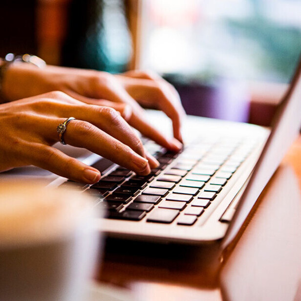 Person typing on laptop