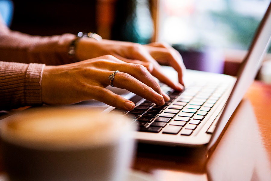Person typing on laptop