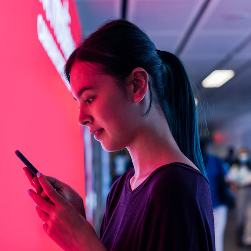 a woman looking at a phone