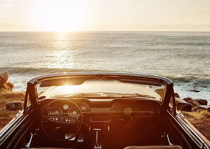a car driving on the beach