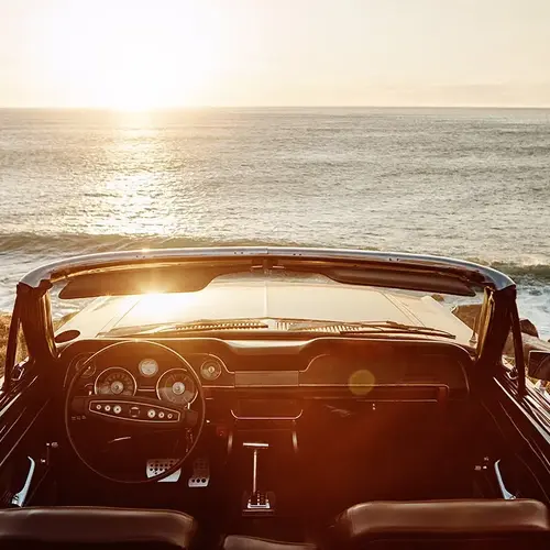 a car driving on the beach