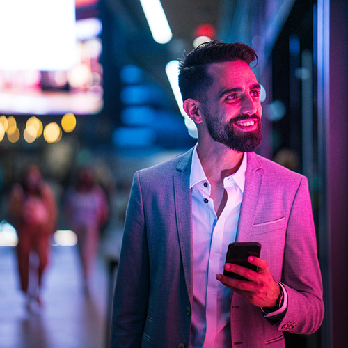 a man in a suit holding a phone