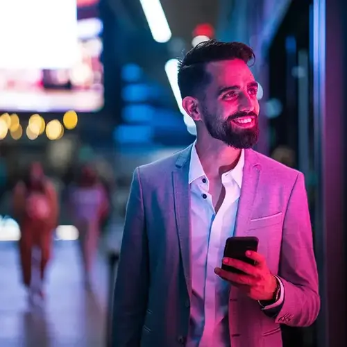 a man in a suit holding a phone