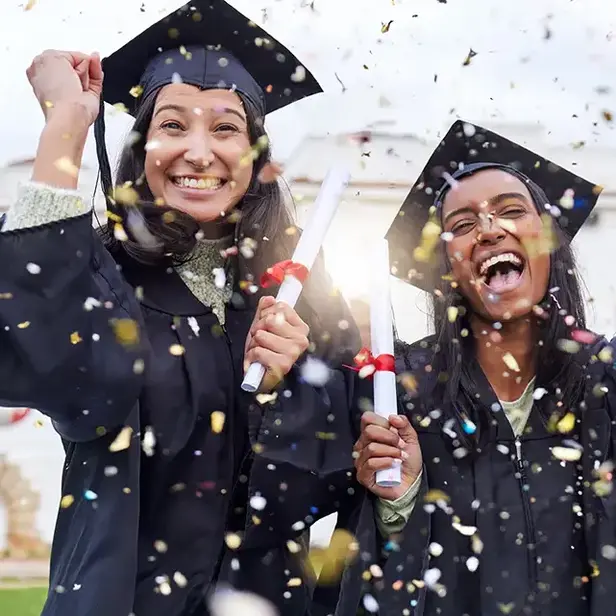 a group of women in graduation gowns and caps