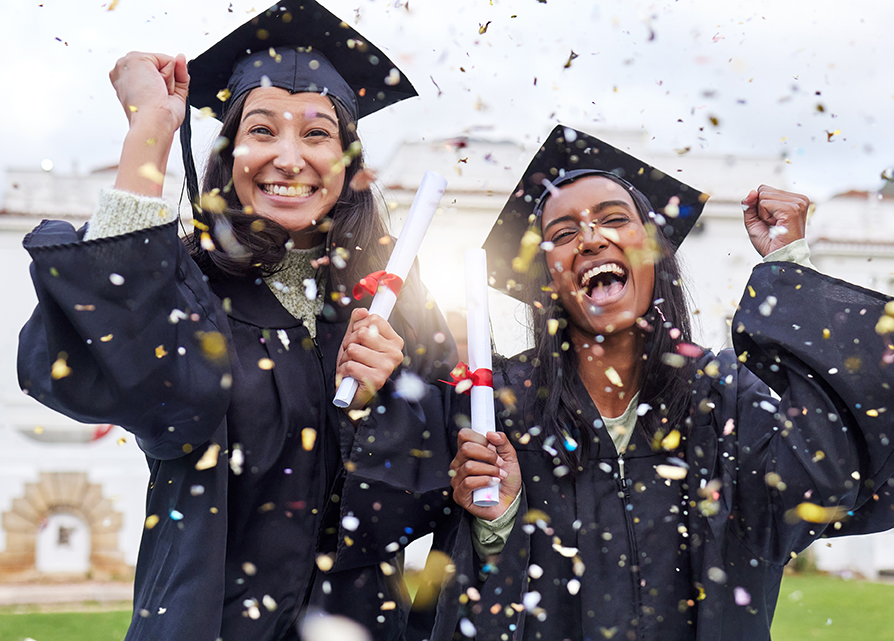 a group of women in graduation gowns and caps
