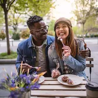 a man and woman eating food