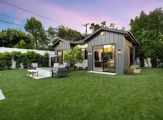 a house with a lawn and a patio