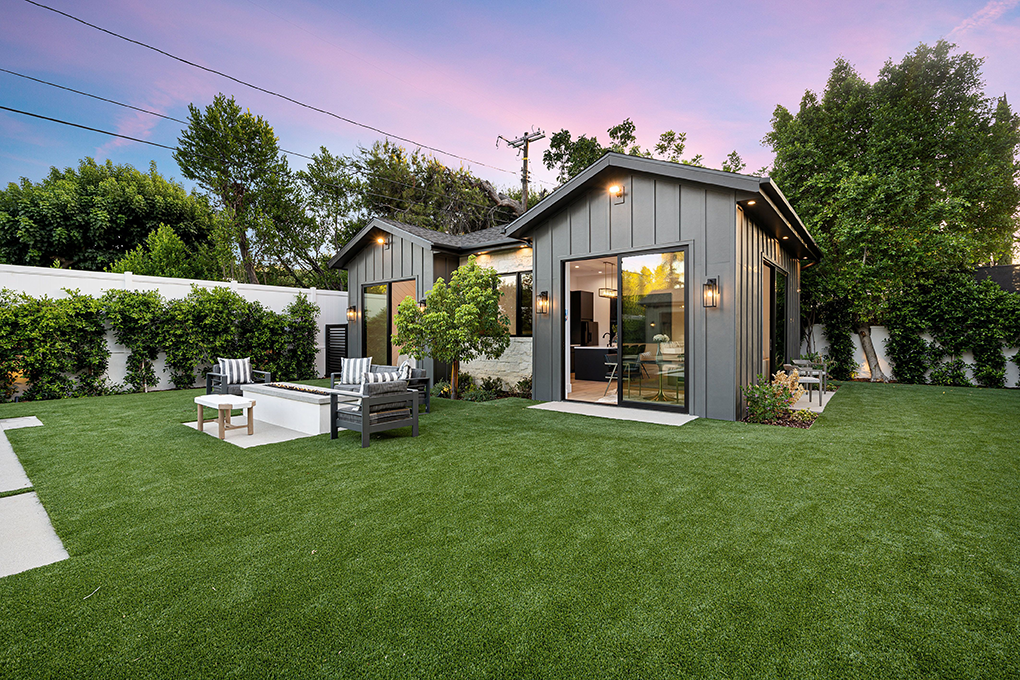 a house with a lawn and a patio