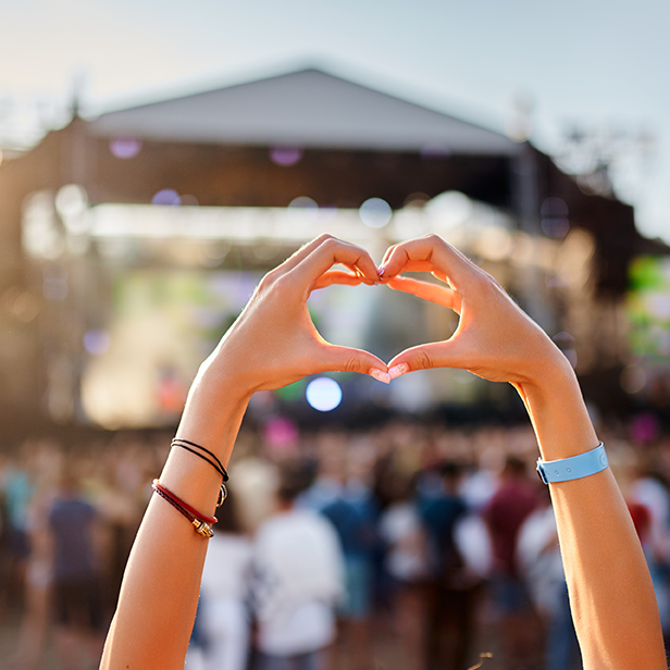 a person making a heart with their hands